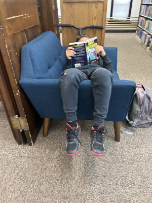 A child reading in a cozy chair 