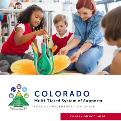 School Implementation Companion Guide introduction page featuring students doing an activity with their teacher.